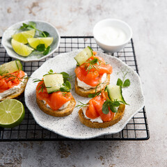 Homemade crostini with smoked salmon and cucumber