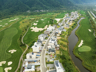 Aerial view of residential neighborhood surrounded by golf courses