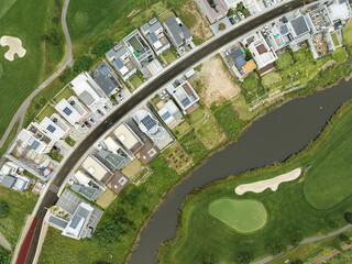 Aerial view of residential neighborhood surrounded by golf courses
