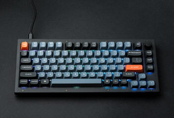Modern mechanical keyboard for your computer. Gray keyboard with orange accent keys	
