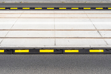 Closeup on road delineator or separator lines for cars for safety in city