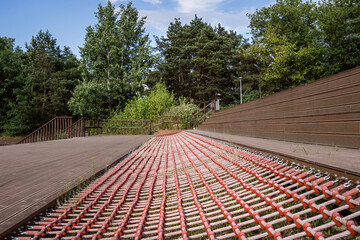 Recreation area with wooden stairs and rope mesh with sitting zone at city park