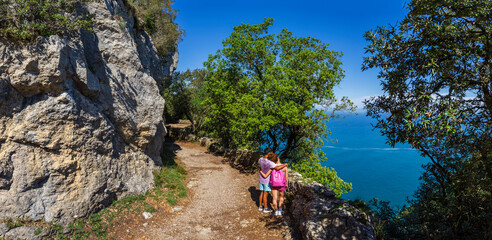 couple hugging watching punta del fraile, Buciero mountain, Santoña, Cantabria, Spain