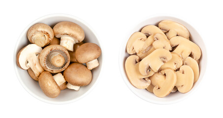 Cultivated brown mushrooms, fresh and canned slices, in a white bowl. Agaricus bisporus, or also...