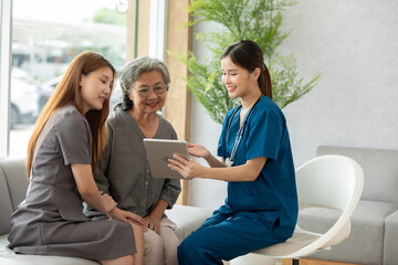 Asian doctor woman visited patient elder woman to diagnosis and check up health at home or private...