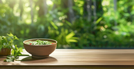 A bowl of steaming Vietnamese Pho Bo, filled with fragrant herbs and fresh noodles, set against a forest background.