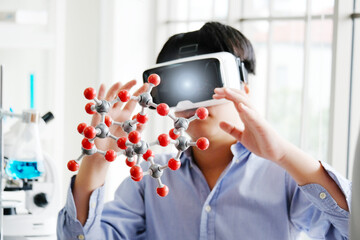 Boy with molecular study experiment.