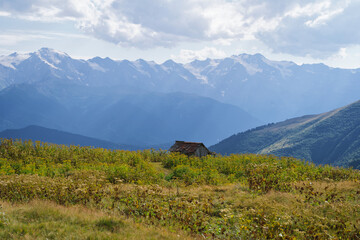 Sun shining on a remote hut in the Georgian mountains