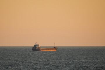 Obraz premium Oil tank in the open Baltic sea at dawn.