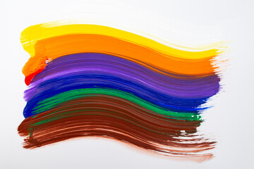 Rainbow colors in shape of a flag painted with a single brush stroke, isolated on white