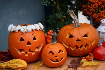 Halloween pumpkins on wooden floor. 