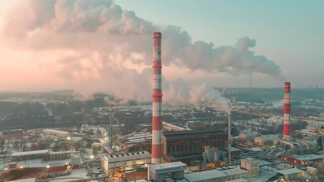 Aerial view of heating plant and thermal power station. Combined modern power station for city district heating and generating electrical power. Industrial zone from above, Vilnius, Lithuania.