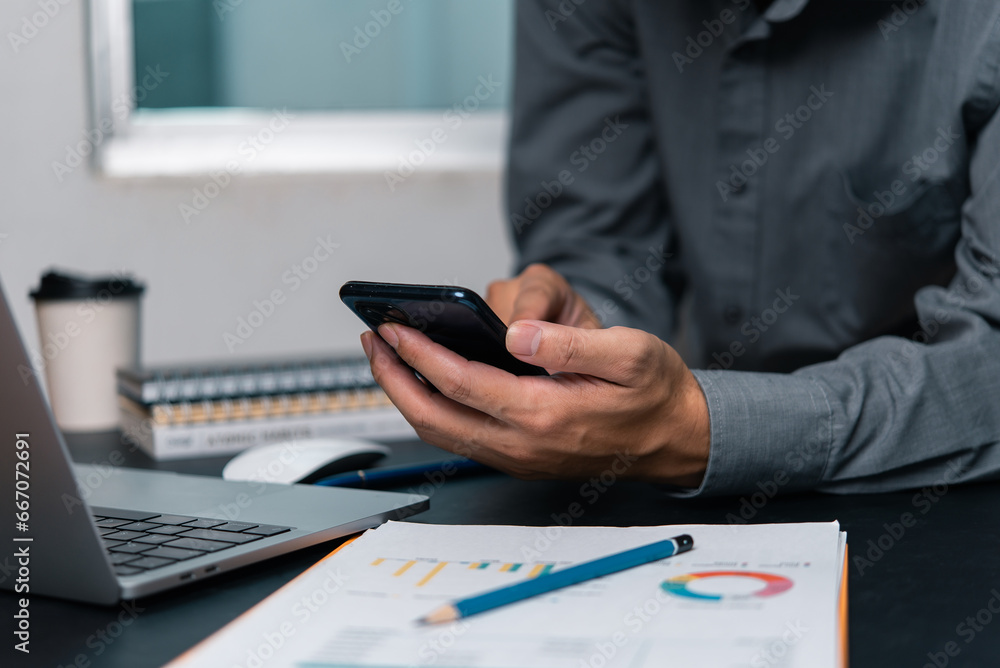 Aufkleber man using mobile smartphone working and digital online computer laptop at office