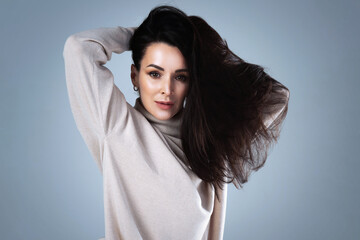  Studio portrait of a stylish young woman wearing a turtleneck jumper