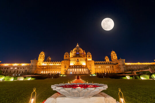 The night view of the hotel is beautiful, with the moon in the sky. Taj Umaid Bhawan Palace, Jaisalmer, Rajasthan, India.