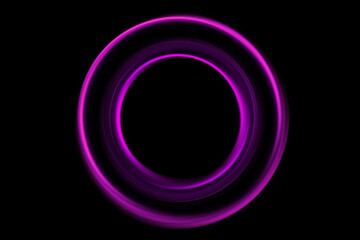 Circle of purple light, captured using long exposure, is isolated against a black background