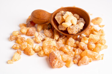 Frankincense or olibanum aromatic resin isolated on white background used in incense and perfumes.