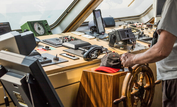 navigating the ship on the captain's bridge