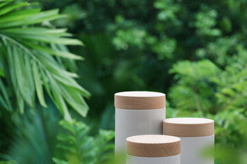 Minimal podium table top outdoors blur green leaf tropical forest plant background.beauty cosmetic healthy natural product placement pedestal display,spring or summer jungle paradise concept...