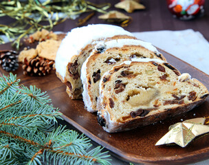 Traditional Christmas pastries stollen on the festive table
