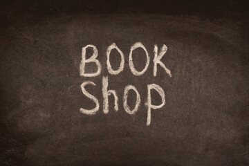 English words bookstore written in chalk on a black board.