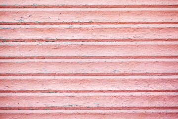 Red paint wooden plank. Bright board. Peeling paint texture. Red wood background. Paint desk texture. Simple wooden wall pattern. Vintage rustic plank. Ancient wooden board.