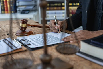 A law firm where justice stands and weighs and judges' perches stand beside justice advice and ideas. Close-up pictures