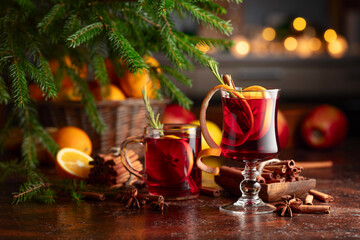 Christmas mulled wine with citrus, apples, cinnamon, anise, and rosemary.