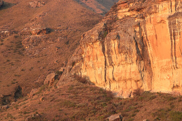 large tall cliff with sunlight on it; Brandwag Buttress impressive sandstone formations rock 
cliff valley Mountain Golden Gate Highlands National Park Free State South Africa North Lesotho