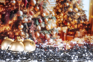 Desk of free space and christmas balls. Home interior and christmas tree. 