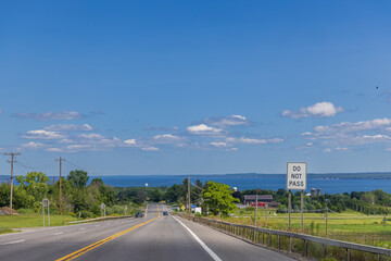 Scenic rural highway leading to Lake Seneca in New York State, United States