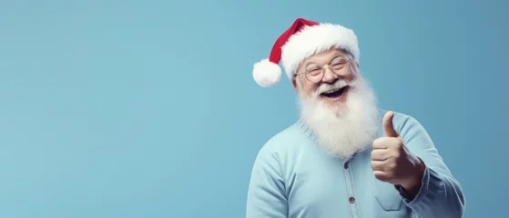 Foto op Canvas Portrait of santa claus showing a thumb up on light blue background © Art AI Gallery