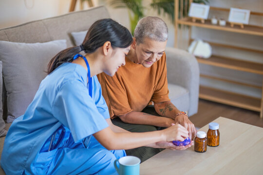 Nurse talks with senior patient about medication. and gives a recommendation to a senior female patient explaining medication