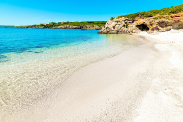 clear water and white sand in Alghero shore
