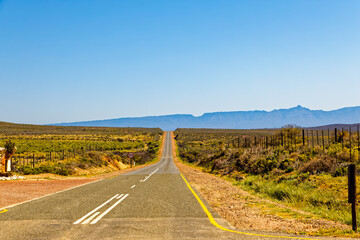 Dead straight highway to Ladismith in Little Karoo with the Swartberg Mountains in the background