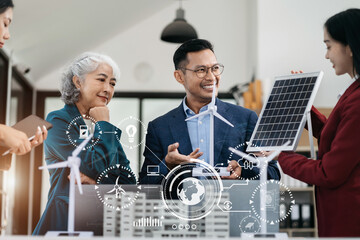Businessman team brainstorming using tablet, laptop computer for working technology and business,  Renewable energy-based green businesses and global warming. green energy and solar panel concept.