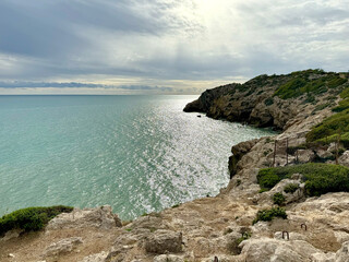 Fototapeta na wymiar Mediterranean sea bay rocks cloudy
