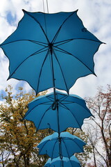 A couple of blue umbrellas