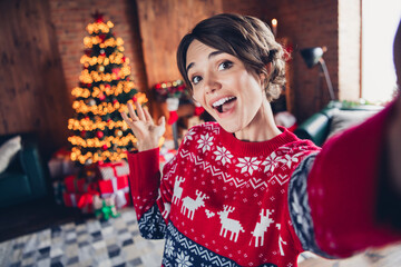 Selfie photo of laughing good mod girl brown bob hair showing her room interior xmas tree lights decor prepared gifts isolated indoors