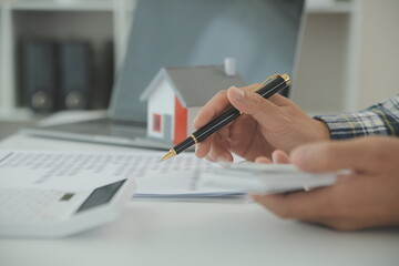 Real estate agent and customer signing contract to buy house, insurance or loan real estate.rent a...