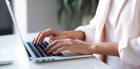 Fototapeta premium close up female hands typing on keyboard pc, working /chatting indoor environment