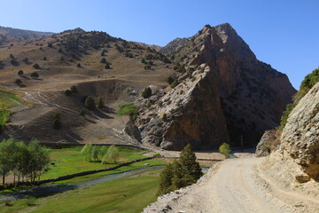 Mountain landscape on a hiking trail from Artuch tu Kulikalon lakes in Fann Mountains, Tajikistan