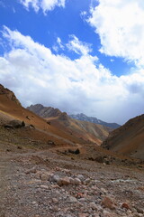 Rocky and glacial mountain landscape on a hiking trail from Iskandarkul to Chimtarga in Fann mountains, Tajikistan