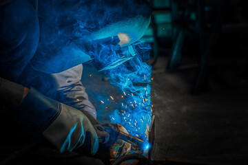 Male welder in steel welding factory.