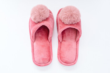 Pink home fluffy slippers on white background