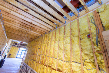 Mineral wool wall assembly with fiber cotton thermal insulation in construction building - obrazy, fototapety, plakaty
