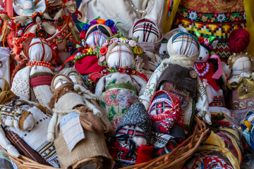 Close-up of a traditional amulet doll for sale to tourists at a street market, Kyiv, Ukraine. Ukrainian motanka dolls