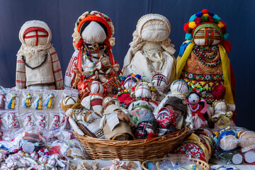 Close-up of a traditional amulet doll for sale to tourists at a street market, Kyiv, Ukraine....