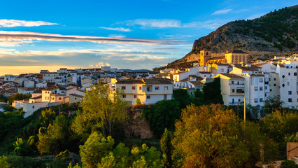 Fototapeta na wymiar Panoramic view of a white Andalusian village on the hill at sunrise, Velez Blanco, Almeria.