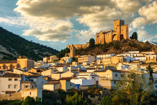 White village of Velez Blanco at dawn with its hilltop castle dominating the surroundings, Andalusia.
